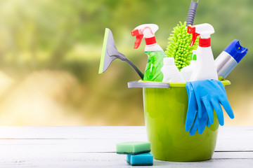 Cleaning concept of cleaning supplies needed to spring cleaning. Cleaning equipment at spring...