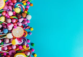   sweets, lollipop, chewing gum, candies etc on blue background © OlegDoroshin