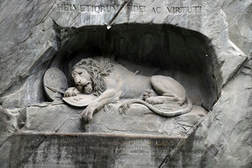 The Lion Monument or the Lion of Lucerne, designed by Bertel Thorvaldsen is a rock relief in...