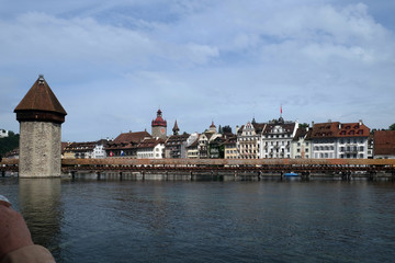 Obraz premium Historic city center of Lucerne with famous Chapel Bridge, the city's symbol and one of the Switzerland's main tourist attractions