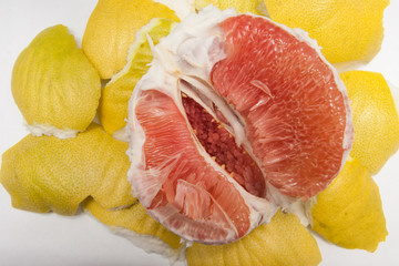 yellow peeled pomelo cut in half. macro of insides