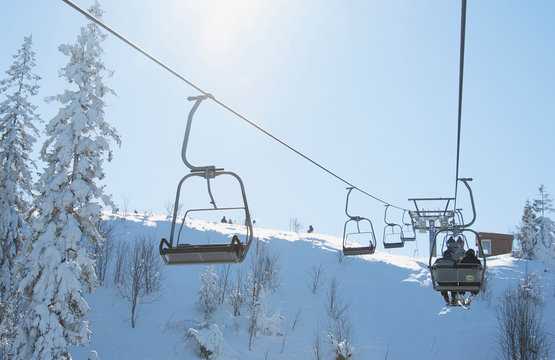 skiers on lift