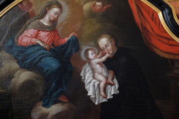 Obraz na płótnie Canvas Saint Stanislaus Kostka reciving the infant Jesus, Adoration of the Magi altar in Jesuit church of St. Francis Xavier in Lucerne, Switzerland
