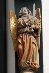 Fototapeta premium Archangel Michael statue on the building facade in Lucerne, Switzerland