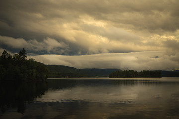 Naklejka premium Sunset sky reflections in Jonsvatnet lake, Norway.