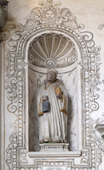 Saint Benedict statue on the facade of the church of St. Leodegar in Lucerne, Switzerland