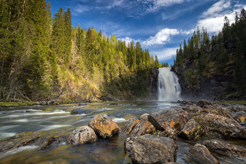 Storfossen waterfall in boreal forest. Homla river, Norwegian outdoors.