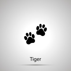 Fototapeta na wymiar Tiger paws, steps imprints, simple black silhouette