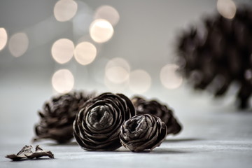 christmas decoration on wooden background with pines and lights