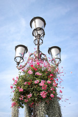 old street lamp on background of blue sky