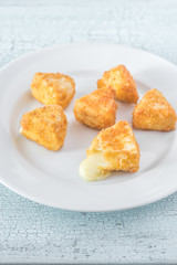 Brie fritters on the white plate