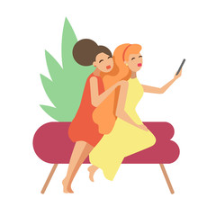 Girlfriends in bright dresses take selfies on the couch