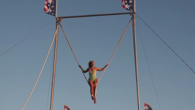 Women Acrobatic on high swing