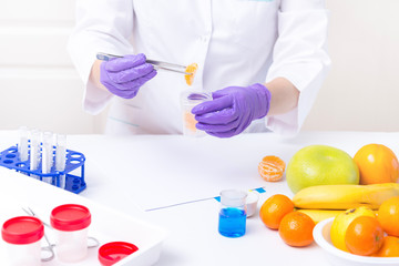 Woman collect samples of Fruits for laboratory test, Food Safety Testing