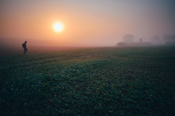Alone man - morning mist in autumn nature