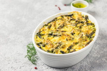 Creamy green bean casserole in a baking dish. Top view, space for text.