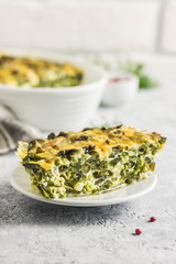 Cheesy green bean casserole in a baking dish. Selective focus, space for text.