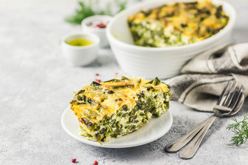 Cheesy green bean casserole in a baking dish. Selective focus, space for text.