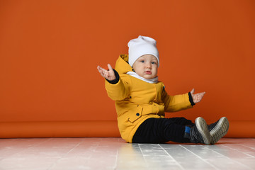 Children in winter clothes. Kids in down jackets. Fashion child © FAB.1