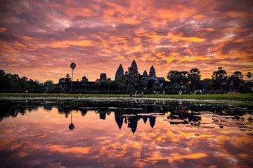 Fototapeta na wymiar SIEM REAP, CAMBODIA - 13 December 2014:View of Angkor Wat complex at sunrise, Archaeological Park in Siem Reap, Cambodia, UNESCO World Heritage Site and popular tourist attraction
