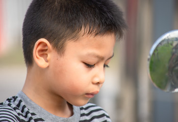 Portrait of Asian boy Tired expression