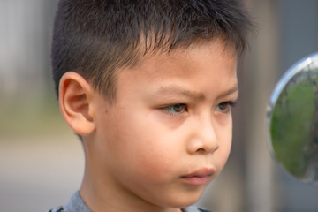 Portrait of Asian boy Tired expression