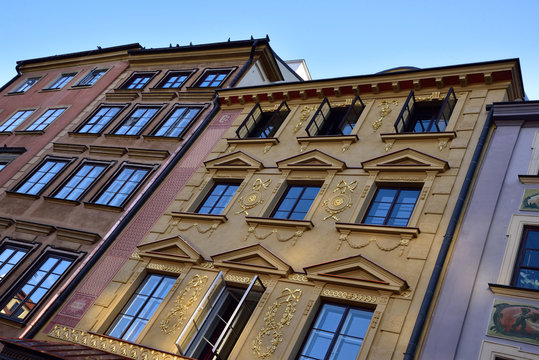 Decorated tenement houses of the old city of Warsaw, photo at an angle.