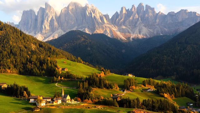 Time lapse of Santa Maddalena village with majestic Dolomite mountains in background, Val di Funes valley, Trentino Alto Adige region, Italy, Europe.