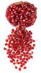 Cut the pomegranate with scattered grain top view isolated