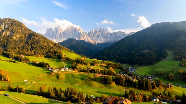 Time lapse of Santa Maddalena village with majestic Dolomite mountains in background, Val di Funes valley, Trentino Alto Adige region, Italy, Europe. Sunset in a  Italian Dolomites.