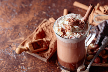 Cocoa with cream, cinnamon, chocolate pieces and various spices.