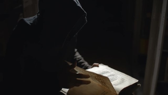 Dark Wizard is reading a book