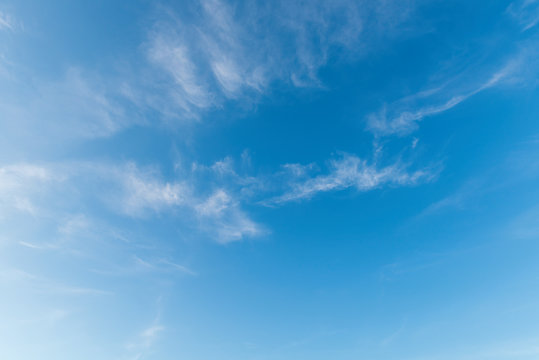 Fresh blue sky puffy white clouds background