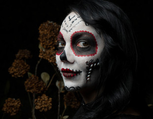 Portrait of girl with make-up skeleton on her face. Halloween.