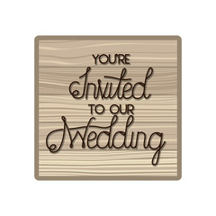 wedding invitation in frame of wooden