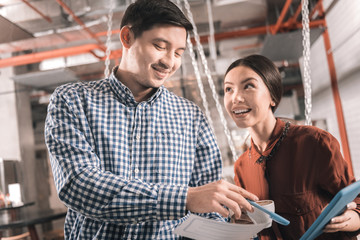 Inspired man telling his business partner about exciting project