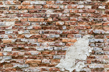 Close-up shot of abandoned old grunge rustic brick wall.