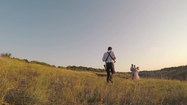 wedding photographer takes pictures of the bride and groom