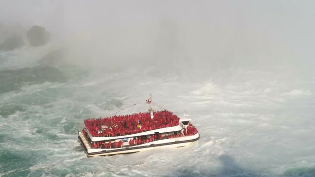 Niagara Falls Boat under Horseshoe Waterfall Rainbow.