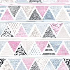 Seamless abstract pattern hand-drawn triangles in doodle style. Vector illustration. Ethnic and tribal motifs. Pink, gray on white.