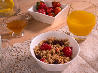Muesli, fresh strawberries, orange juice, honey - the best breakfast for your health