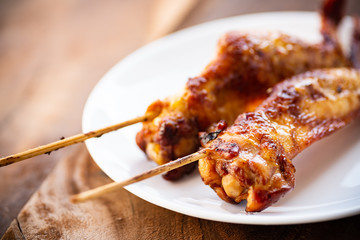 Grilled chicken wing with bamboo stick, Thai style