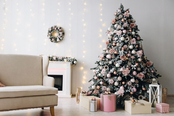 Very cozy and modern Christmas interior design idea with gorgeous Christmas tree, lights and a fireplace