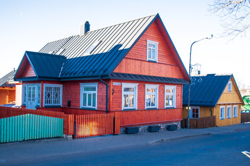 Old lithuanian red wooden house with three windows in Trakai, Vilnius, Lithuania 
