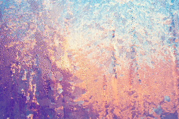 Frosty ice pattern on glass of window