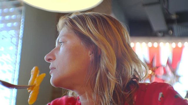 Woman takes a meal in a restaurant. 1920X1080 Full Hd.
