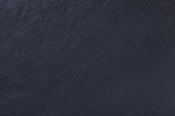 Dark gray background of natural slate. Texture black stone
