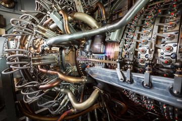 Gas turbine engine of feed gas compressor located inside pressurized enclosure, The gas turbine engine used in offshore oil and gas central processing platform.