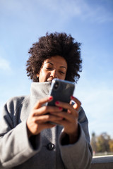 Fototapeta premium Afro woman having fun in the park