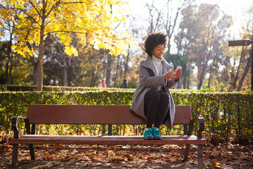 Fototapeta premium Afro woman having fun in the park